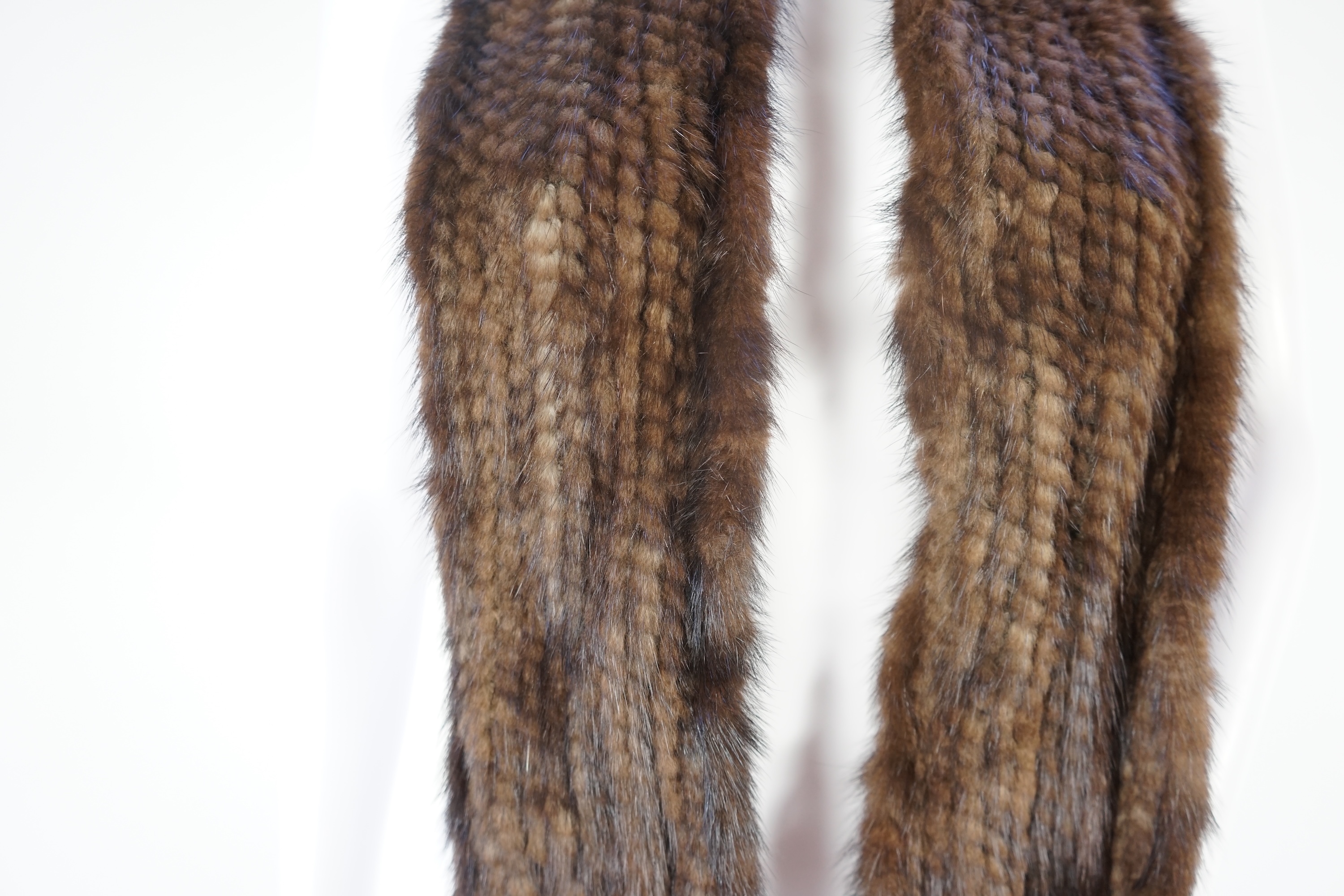 A selection of fur scarves and a fur gilet